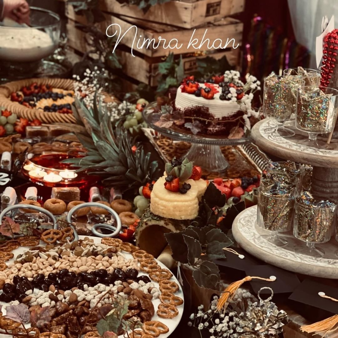Rustic dessert and grazing table with cakes and candles