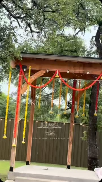 Outdoor wooden mandap dressed in marigold garlands